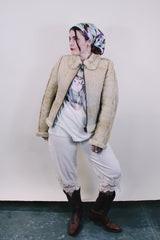 Women's or men's western style vintage 1970's Knight Tailors LTD label long sleeve short length cream colored suede jacket with shearling liner and trim.