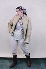 Women's or men's western style vintage 1970's Knight Tailors LTD label long sleeve short length cream colored suede jacket with shearling liner and trim.