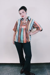 Women's vintage western style 1980's short sleeve pullover blouse in green, peach, and brown vertical striped patterns. Collar and V shaped neckline.