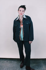 Women's or men's vintage western style 1970's dark forest green polyester two piece suit and jacket suit. Light green contrast thread throughout.