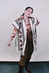 Women's vintage western style 1970's knee length cream colored blanket vest. Sleeveless with tassel closure and fringe trim. Bird and leaf print.