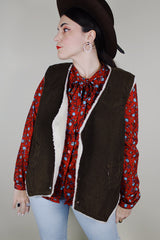 Men's vintage 1970's Levi's sleeveless brown corduroy vest with a cream shearling liner and popper buttons up the front