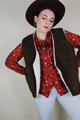 Men's vintage 1970's Levi's sleeveless brown corduroy vest with a cream shearling liner and popper buttons up the front