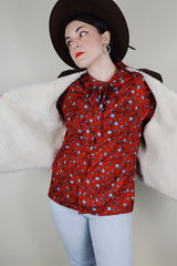 Men's vintage 1970's Levi's sleeveless brown corduroy vest with a cream shearling liner and popper buttons up the front