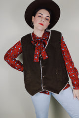 Men's vintage 1970's Levi's sleeveless brown corduroy vest with a cream shearling liner and popper buttons up the front