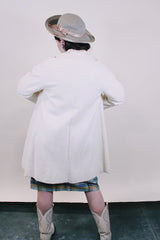 Women's vintage 1960's Lilli Ann, Paris & San Francisco label 3/4 arm length long length cream colored vinyl polyester coat with big round gold buttons and four front pockets