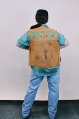 Women's or men's western style vintage 1970's sleeveless brown tan colored suede vest with all over teal colored hand painting.