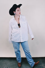 Women's or men's western style vintage 1970's Ely Plains, Since 1978 label long sleeve white button up shirt with pockets, collar, and pearl snapper buttons.