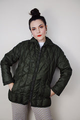 Women's vintage 1970's White Stag, USA label long sleeve olive green nylon quilted puffer jacket with silver zipper up the front