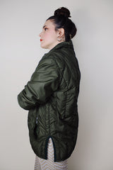 Women's vintage 1970's White Stag, USA label long sleeve olive green nylon quilted puffer jacket with silver zipper up the front