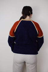 Women's vintage 1980's Silton California long sleeve v shaped neck pullover sweater in a navy textured material with burnt orange and tan shoulders