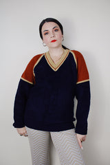 Women's vintage 1980's Silton California long sleeve v shaped neck pullover sweater in a navy textured material with burnt orange and tan shoulders