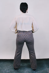 Women's or men's vintage western style 1970's polyester material brown plaid pants in chocolate brown, tan, and white. Four pockets, belt loops, and zipper closure with slight bell bottoms.