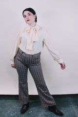 Women's or men's vintage western style 1970's polyester material brown plaid pants in chocolate brown, tan, and white. Four pockets, belt loops, and zipper closure with slight bell bottoms.