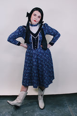 Women's vintage western style 1970's Candi Jones California label long sleeve midi length prairie dress in navy cotton material with all over ditsy floral print.