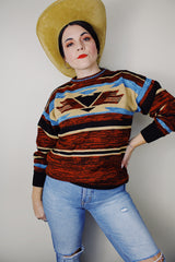 vintage 1970's Montgomery Ward long sleeve acrylic material pullover sweater with a brown, maroon, tan, and blue all over print