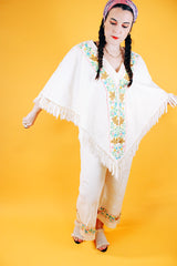1970's cream colored fringed poncho and pant set with floral and bird embroidery