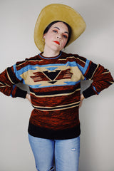 vintage 1970's Montgomery Ward long sleeve acrylic material pullover sweater with a brown, maroon, tan, and blue all over print