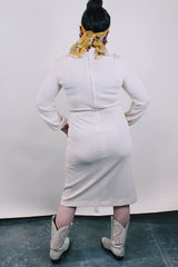 Women's vintage 1970's Keith Adams For Tannel label long sleeve midi length cream tan colored tunic dress with embroidered neckline with bead and a tassel beaded belt.