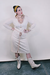 Women's vintage 1970's Keith Adams For Tannel label long sleeve midi length cream tan colored tunic dress with embroidered neckline with bead and a tassel beaded belt.