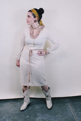 Women's vintage 1970's Keith Adams For Tannel label long sleeve midi length cream tan colored tunic dress with embroidered neckline with bead and a tassel beaded belt.