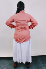 Men's or women's vintage western style 1970's Ely Plains Rider, Ely C. Walker USA label long sleeve shirt with pearl snapper buttons, chest pockets, dagger collar in orange with rose print.