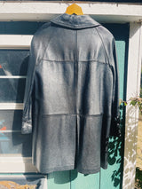 long sleeve black long leather jacket, collar and buttons up the front vintage 1960's