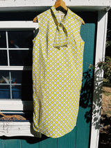 sleeveless mid length shift dress with tie neck grey with yellow floral print vintage 1960's