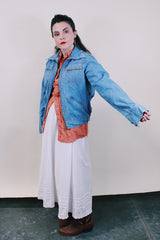 Women's or men's vintage western style 1970's Britannia Sportswear label long sleeve medium wash denim zip up jacket with chest pockets, side pockets, and contrast stitching