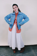 Women's or men's vintage western style 1970's Britannia Sportswear label long sleeve medium wash denim zip up jacket with chest pockets, side pockets, and contrast stitching