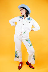 white jacket and pant set with floral embroidery throughout vintage women's 1970's