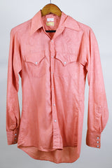 Men's or women's vintage western style 1970's Ely Plains Rider, Ely C. Walker USA label long sleeve shirt with pearl snapper buttons, chest pockets, dagger collar in orange with rose print.