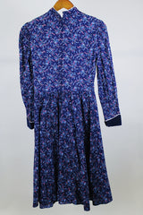 Women's vintage western style 1970's Candi Jones California label long sleeve midi length prairie dress in navy cotton material with all over ditsy floral print.