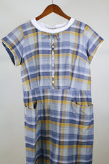 Women's vintage western style 1960's short sleeve midi length plaid print shift dress with white scalloped trim. Grey, teal, and mustard yellow colors.