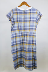 Women's vintage western style 1960's short sleeve midi length plaid print shift dress with white scalloped trim. Grey, teal, and mustard yellow colors.