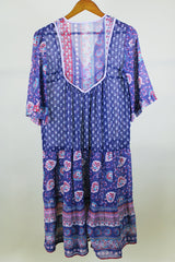 Women's western style vintage 1970's 3/4 arm length midi length boho dress in purple with all over abstract print in sheer lightweight cotton material.