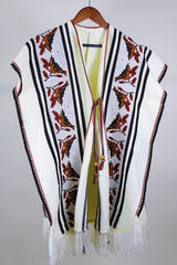 Women's vintage western style 1970's knee length cream colored blanket vest. Sleeveless with tassel closure and fringe trim. Bird and leaf print.