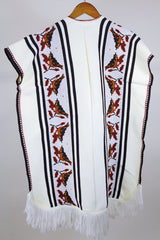 Women's vintage western style 1970's knee length cream colored blanket vest. Sleeveless with tassel closure and fringe trim. Bird and leaf print.