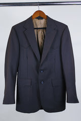 Women's or men's western style vintage 1970's Levi's Western Wear, San Francisco label long sleeve dark chocolate brown polyester blazer with two button closure.