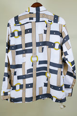 Women's or men's western style vintage 1970's Spire California label long sleeve white polyester button up collared shirt with an all over brown, yellow, and grey belt print.