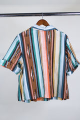 Women's vintage western style 1980's short sleeve pullover blouse in green, peach, and brown vertical striped patterns. Collar and V shaped neckline.