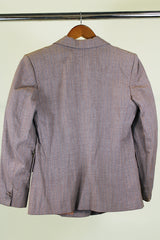 Women's vintage 1950's Jack Frost Woolen Wear, The Original Utah Woolen Mills, Salt Lake City label long sleeve grey colored button up blazer with double lapel, two pockets, and fabric covered buttons.