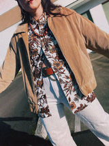 Men's vintage 1970's long sleeve button up shirt with a pointy collar in a lightweight Polyester material. White with all over brown floral print.