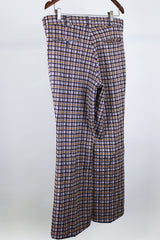 Women's or men's vintage western style 1970's polyester material brown plaid pants in chocolate brown, tan, and white. Four pockets, belt loops, and zipper closure with slight bell bottoms.