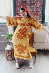 Women's vintage 1970's Fashion Manor, Decorator Collection label short sleeve ankle length dress in a mustard yellow and brown floral print cotton towel material.