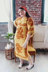Women's vintage 1970's Fashion Manor, Decorator Collection label short sleeve ankle length dress in a mustard yellow and brown floral print cotton towel material.