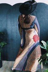 Women's vintage 1970's Tori Richard Honolulu for Liberty House, Made in USA label long sleeve maxi length polyester material all over printed dress with deep V shaped neckline.
