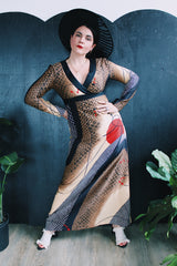 Women's vintage 1970's Tori Richard Honolulu for Liberty House, Made in USA label long sleeve maxi length polyester material all over printed dress with deep V shaped neckline.