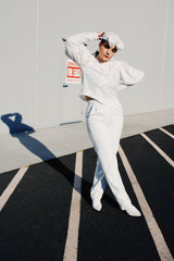 Women's retro vintage 1990's long sleeve white lace blouse with big puff sleeves and buttons in the back