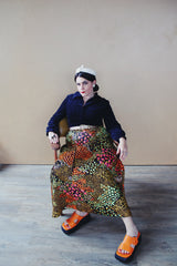 Women's vintage 1960's Lounging Apparel Evelyn Pearson label long sleeve maxi length twofer house dress with a black velvet top part and multicolored floral print skirt.